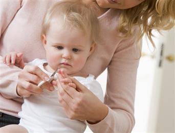 Toddler's nail being trimmed. 