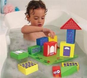 Toddler with bath toys